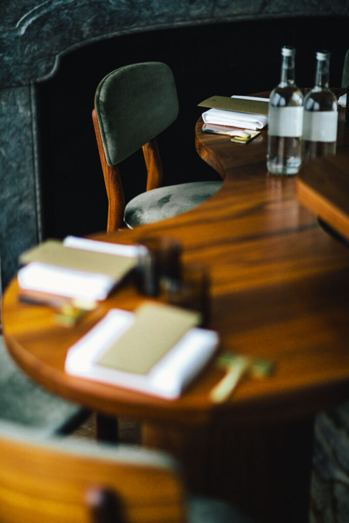 interior of até, Amsterdam's smallest chef's table restaurant by Chef Filip Hanlo in luxury boutique hotel The Dylan Amsterdam. The chefs table consists of 6 chairs at the counter.